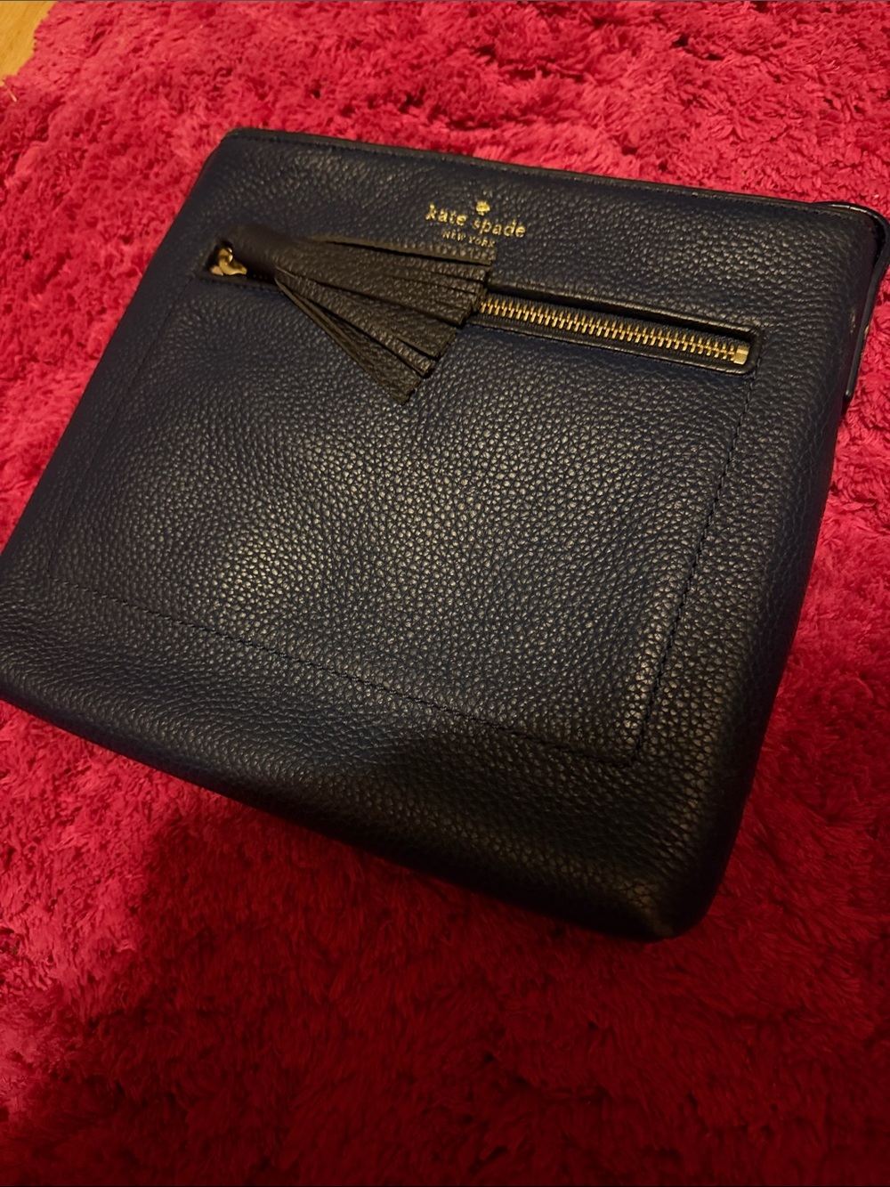 kate spade navy pebbled leather messenger with tassel and gold zipper